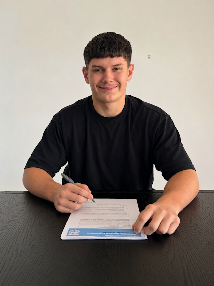 Max Tutt, founder of Made by Max web design in Lake Macquarie, signing his three-year rugby league deal with the Sydney Roosters pathway